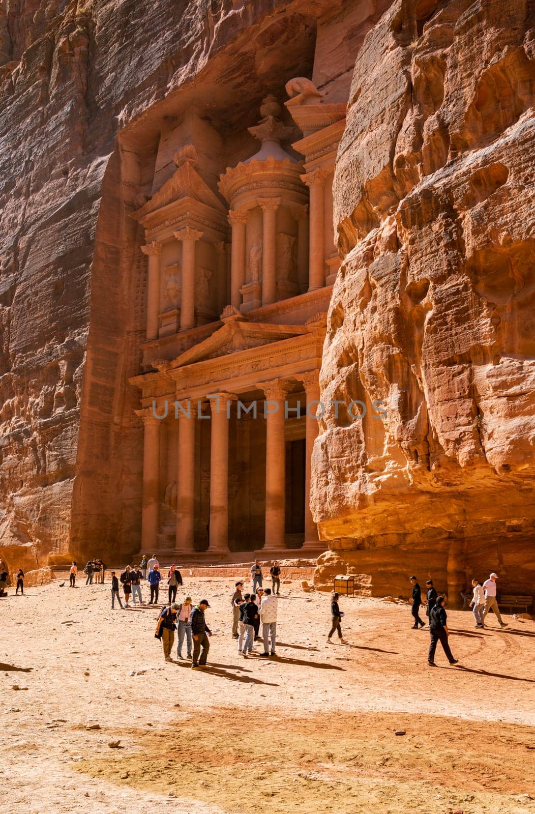 Petra, Jordan - 10 November 2024: Tourists at the carved facade of the Treasury building or Al-Khazneh in the ancient city of Petra