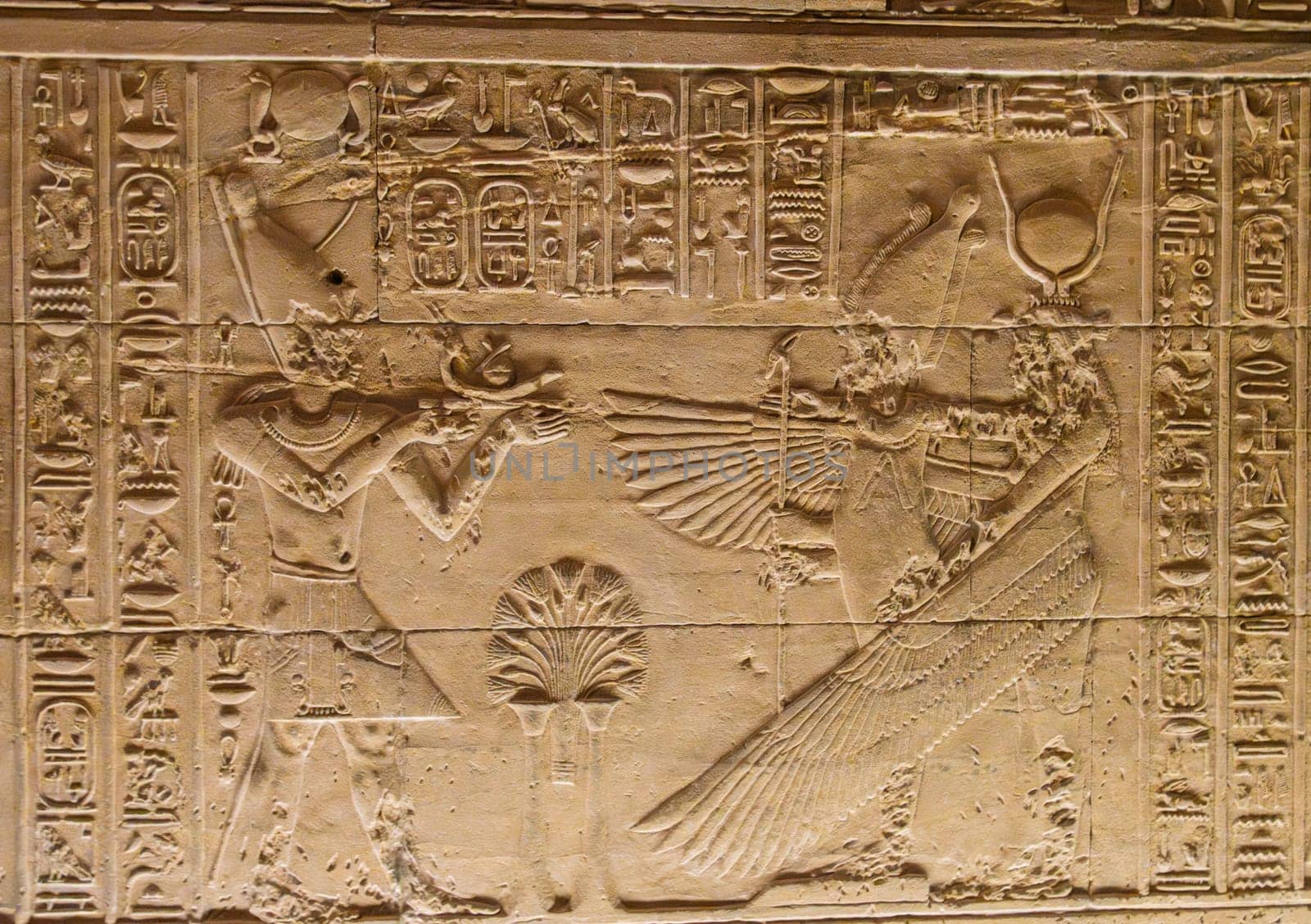 Detail of the bas-relief carving of the goddess Isis spreading wings in the Philae Temple in Aswan Harbor or Reservoir in Egypt