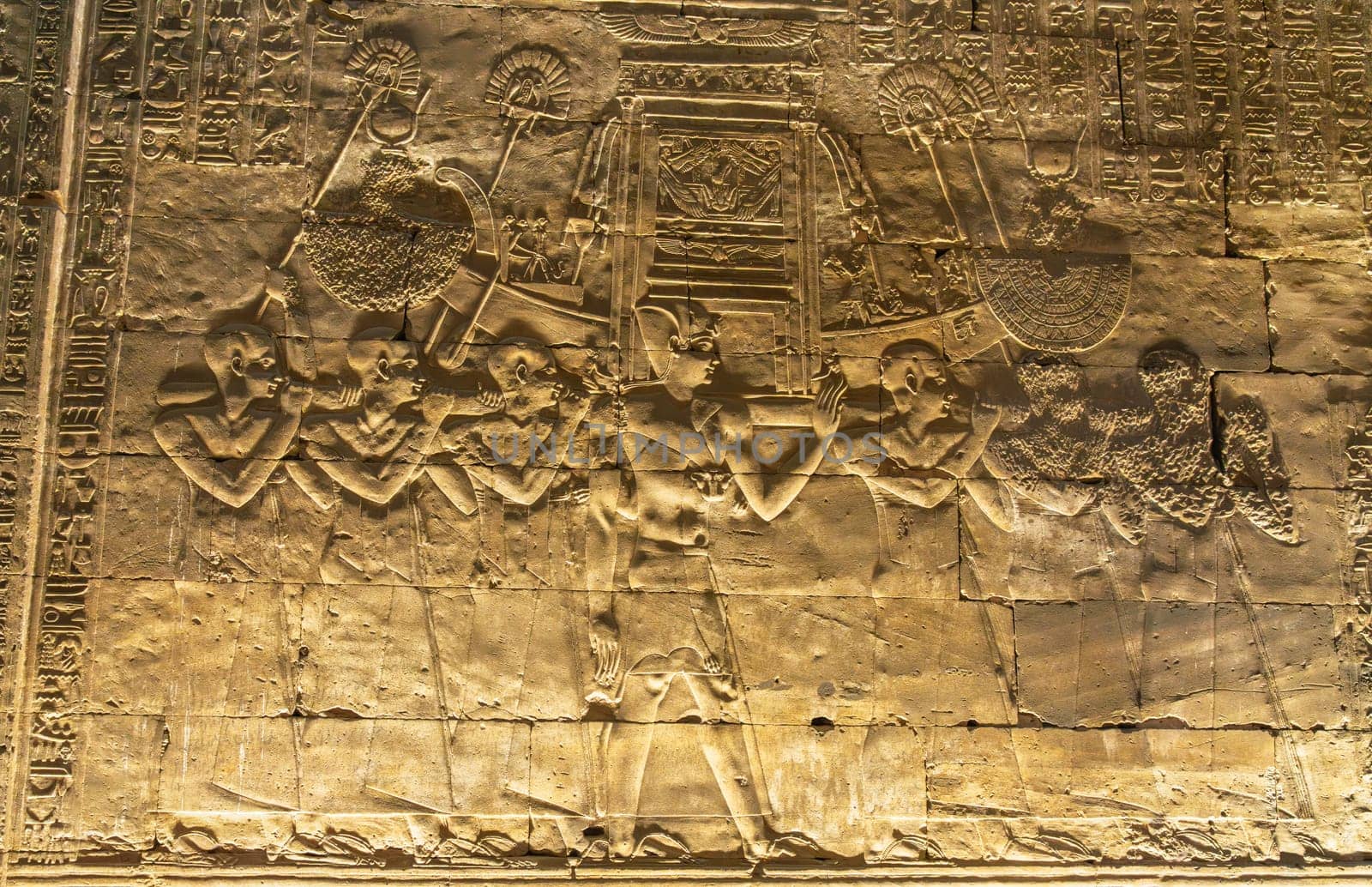 Detail of the carved images inside the temple in Edfu dedicated to Horus and Hathor showing slaves carrying funeral boat