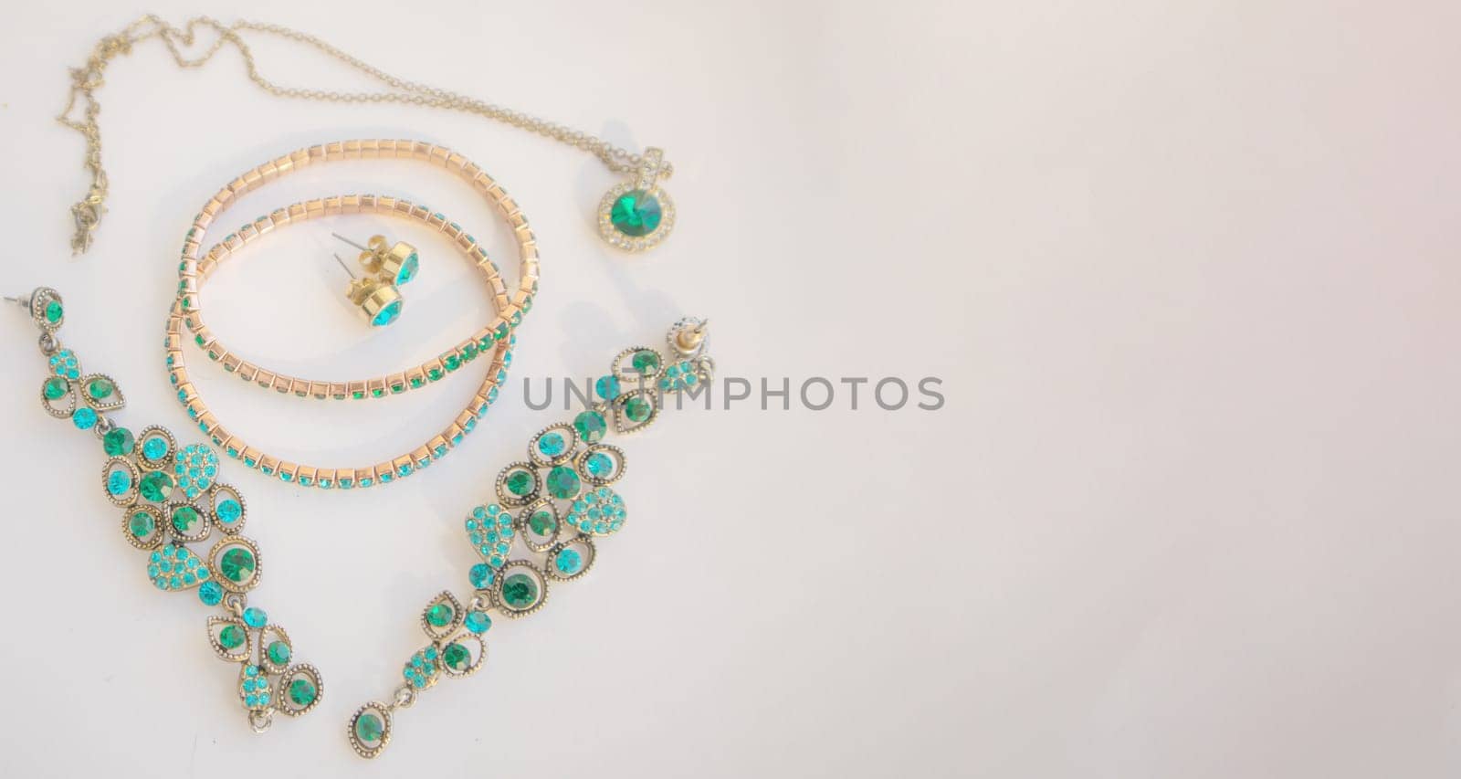 Set of beautiful green stone jewelry, banner, copy space at right.