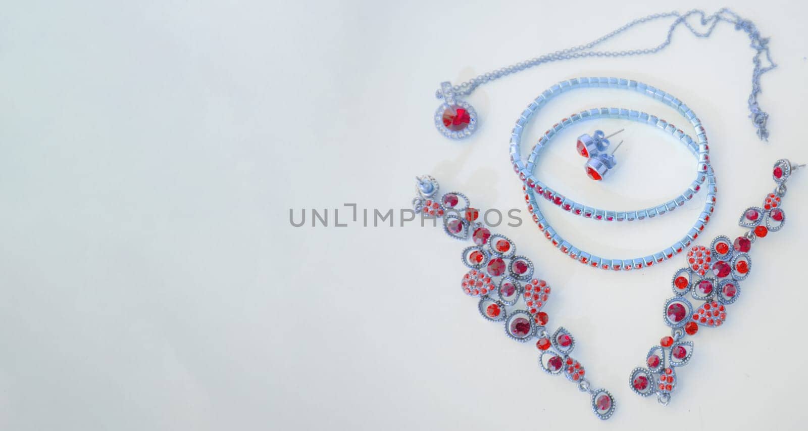 Set of fine jewelry, pink and blue toning, banner, copy space at left.