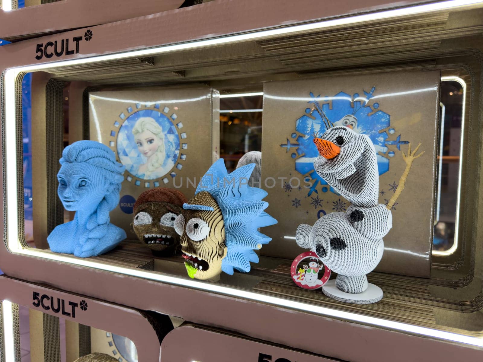 Moscow, Russia, April 25, 2025: Display of cartoon character busts made of layered cardboard in 5CULT store, featuring designs from Frozen and Rick and Morty as part of collectible pop culture art