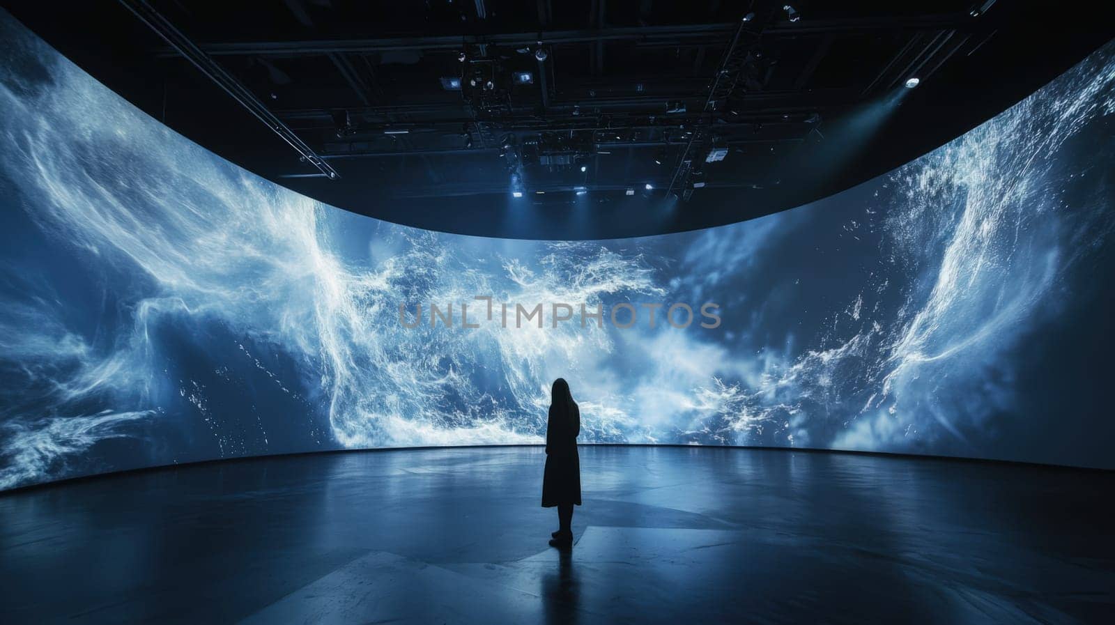 Silhouette on stage, enhanced by captivating visuals