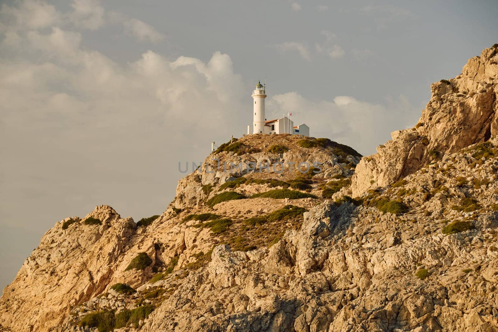 lighthouse on a high mountain at sunset. High quality photo