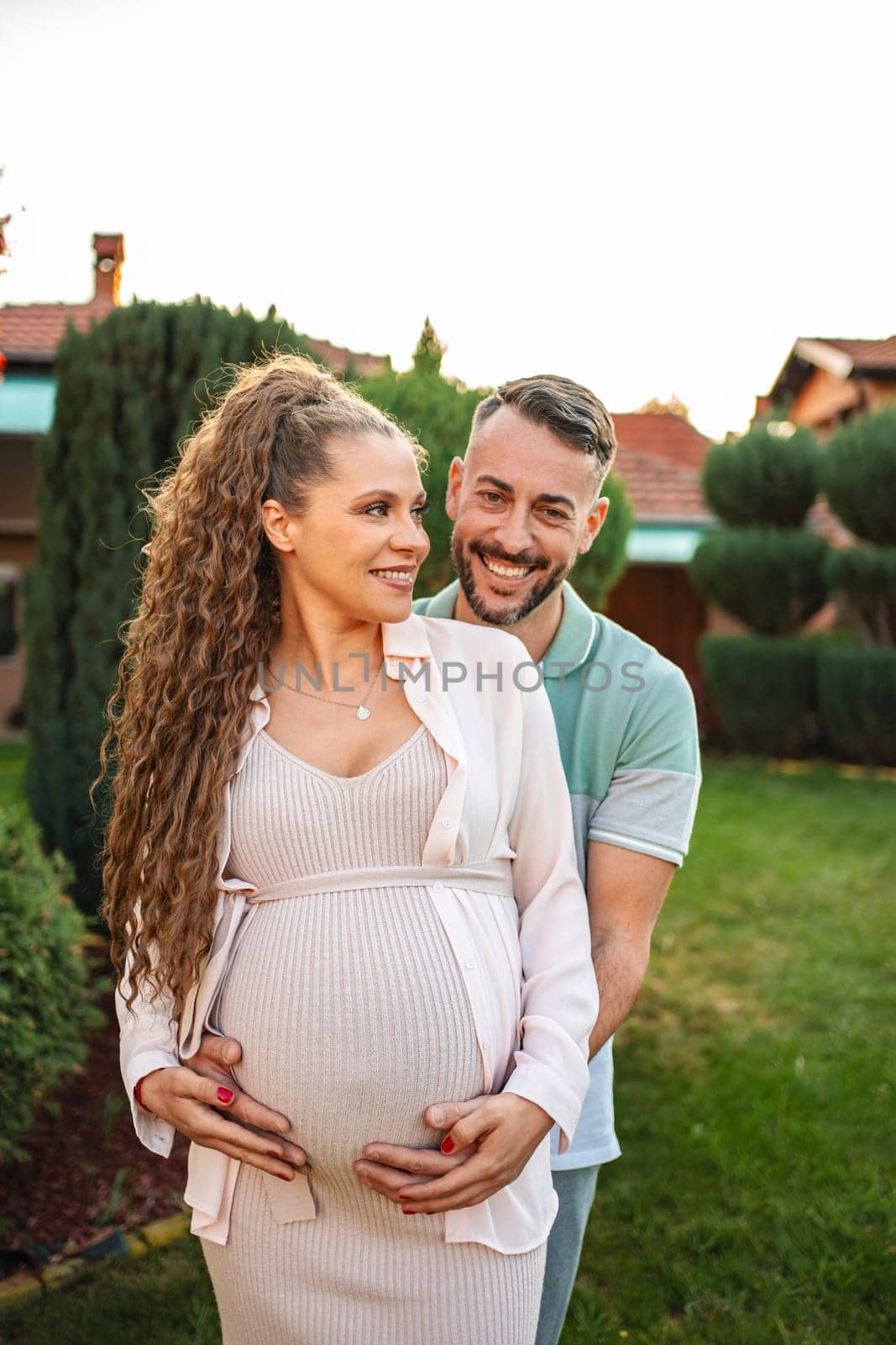 Couple shares a tender moment as they prepare for parenthood.