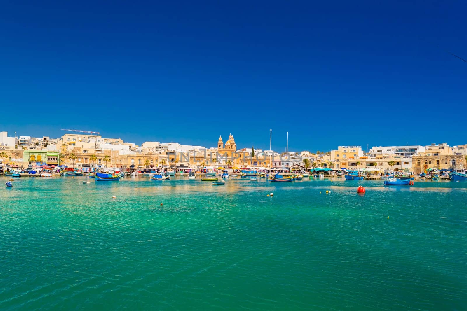 Cityscape of Marsaxlokk, a small coastal town in Malta.
