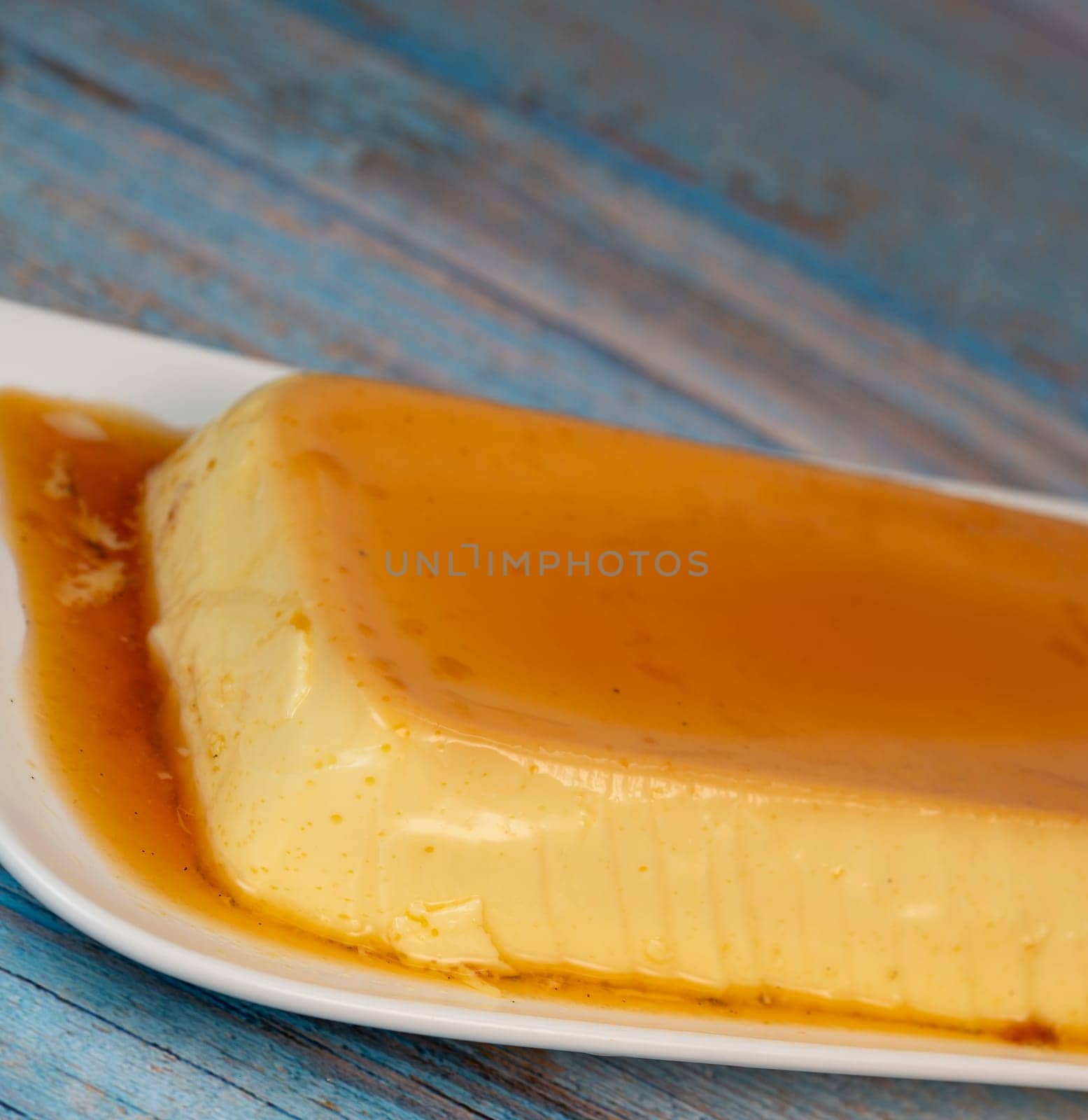 Cream caramel pudding with caramel sauce on a plate, Flan, High quality photo