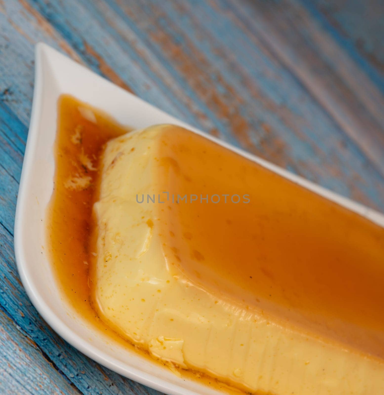 Cream caramel pudding with caramel sauce on a plate, Flan, High quality photo