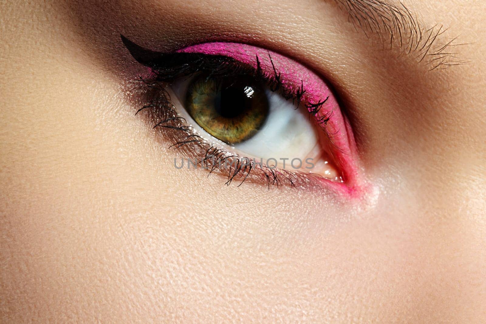 Closeup Macro of Woman Face with Pink Eyes Make-up. Fashion Celebrate Makeup, Glow Clean Skin. Trendy Style