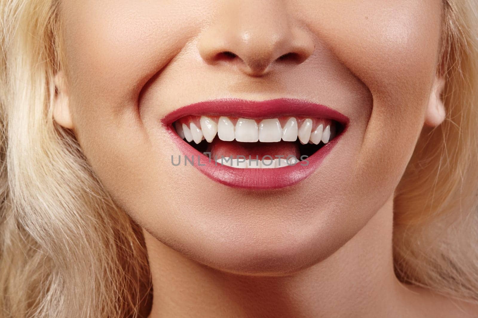 Cropped half face portrait of woman. Closeup Dental Beauty. Beautiful Macro with perfect White Teeth. Sexy Fashion Lips Red Make-up. Whitening Tooth and Wellness Treatment