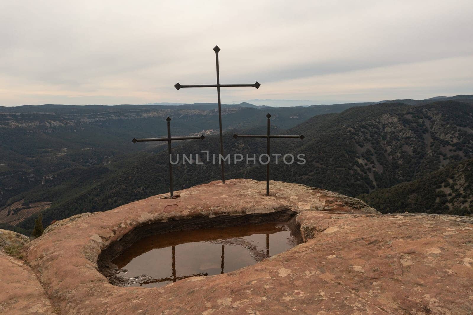 Three iron crosses on Mola d'Estat mountain peak in Tarragona