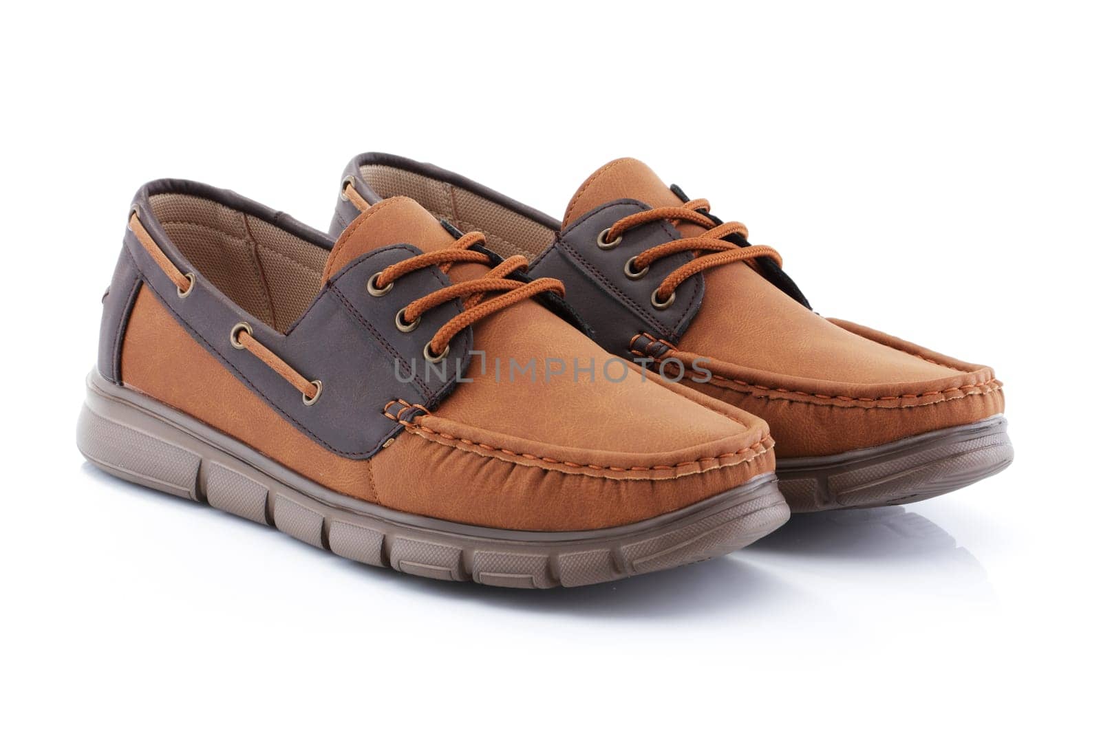 A pair of mens brown shoes loafers side view