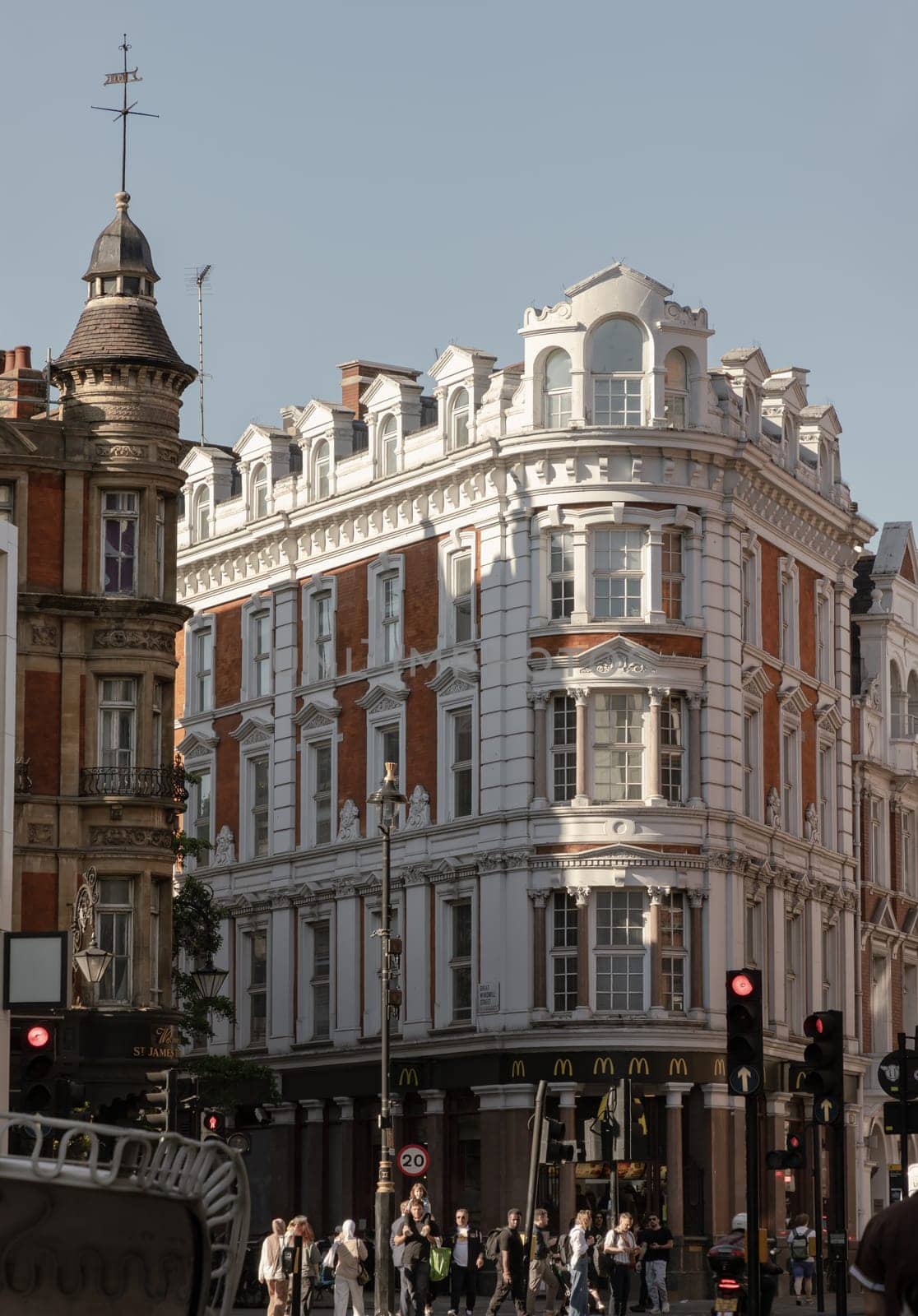 London, UK - May 13, 2025 - A scenery view of The historic building and below is McDonald's restaurant at Shaftesbury avenue and Denman street in London. use it as your Wallpaper, Poster and Space for text, Selective focus.