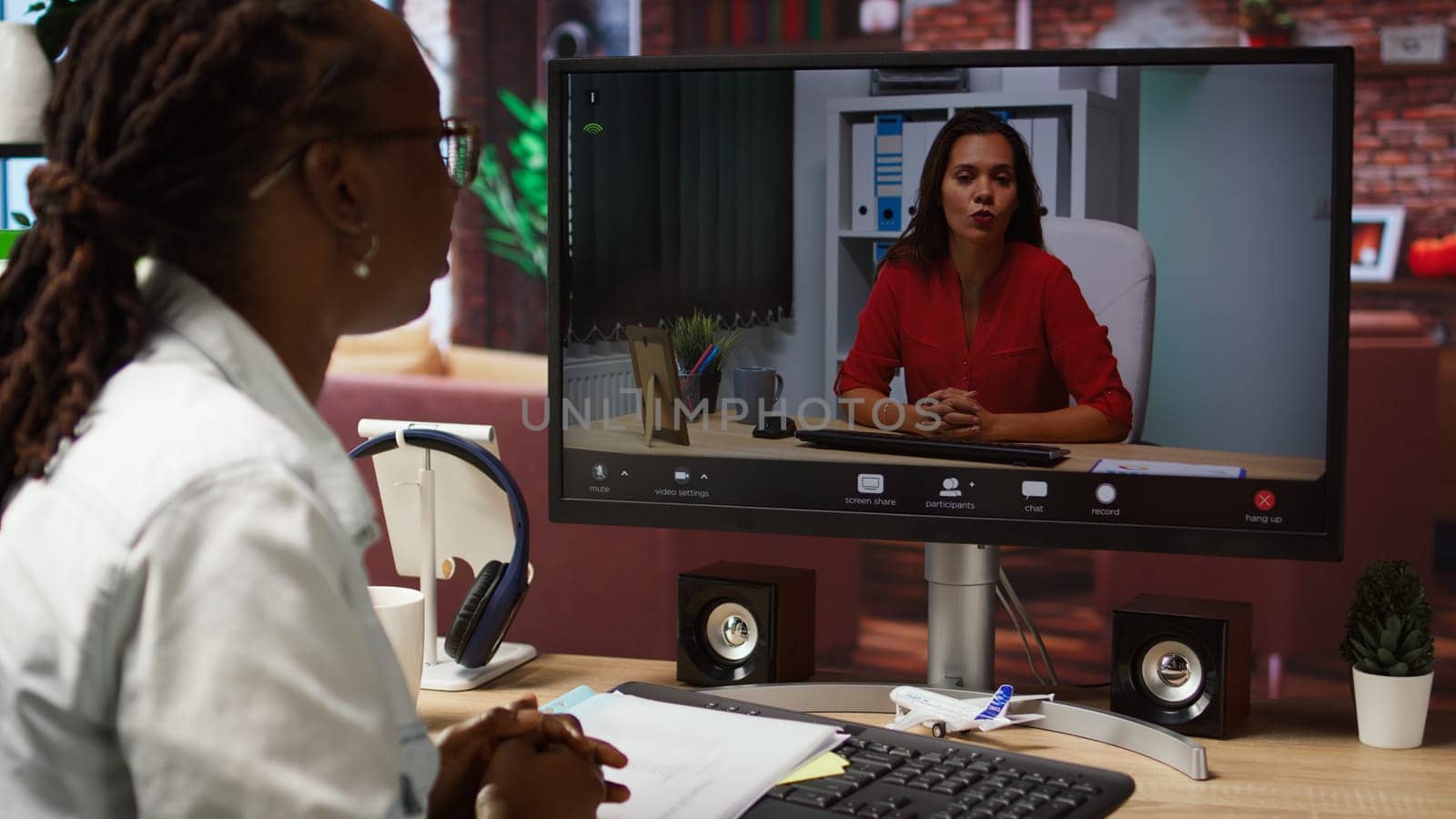 Woman doing videocall interview with human resources representative, applying for company position. Candidate at home doing teleconference meeting with HR employer, camera A
