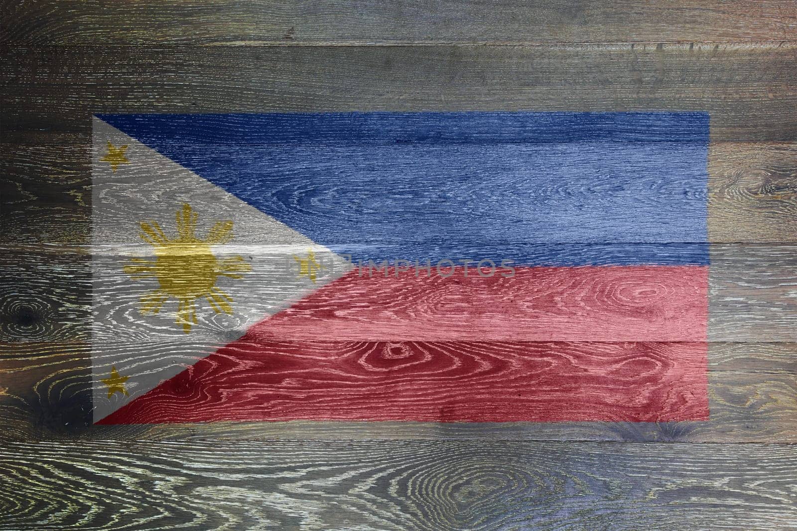 A Philippines flag on rustic old wood surface background