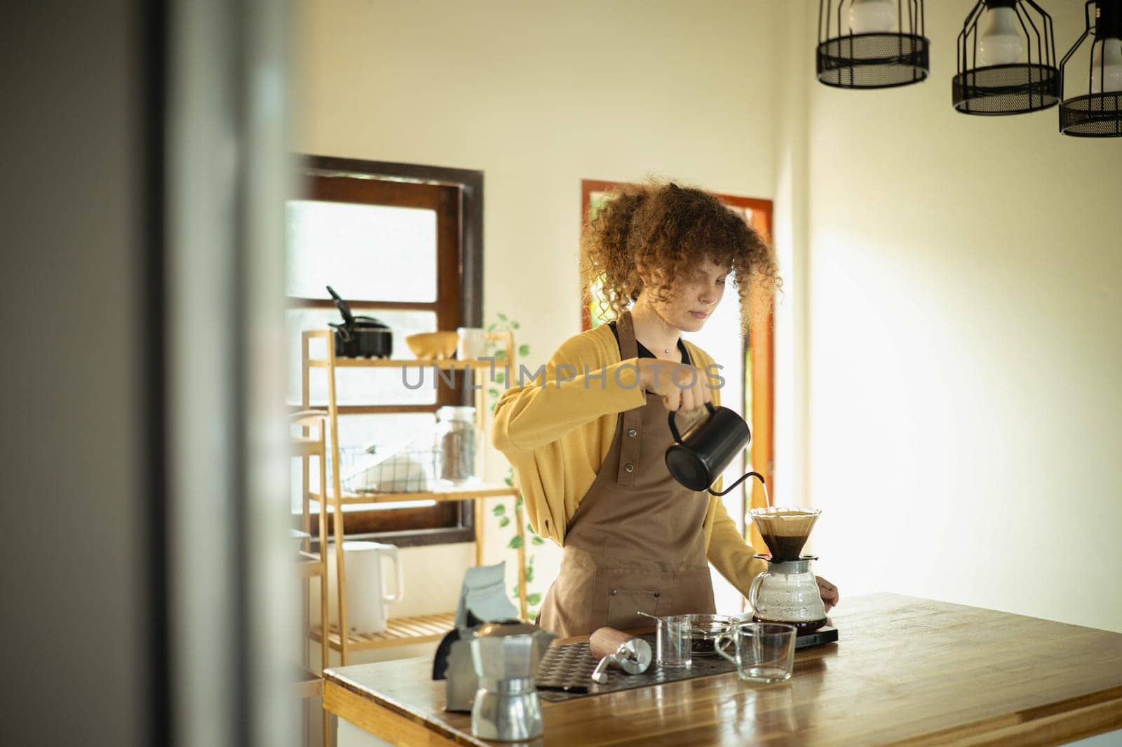 Modern lifestyle and homemade brewing barista style coffee preparation at home.