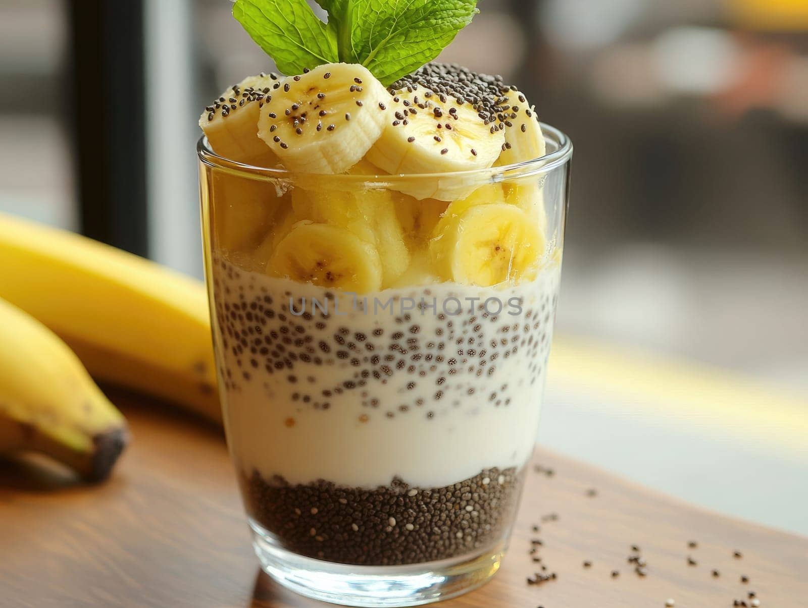 Delicious chia seed pudding layered with yogurt and garnished with fresh banana slices. This nutritious treat is perfect for breakfast or a healthy snack. Enjoy it anytime!