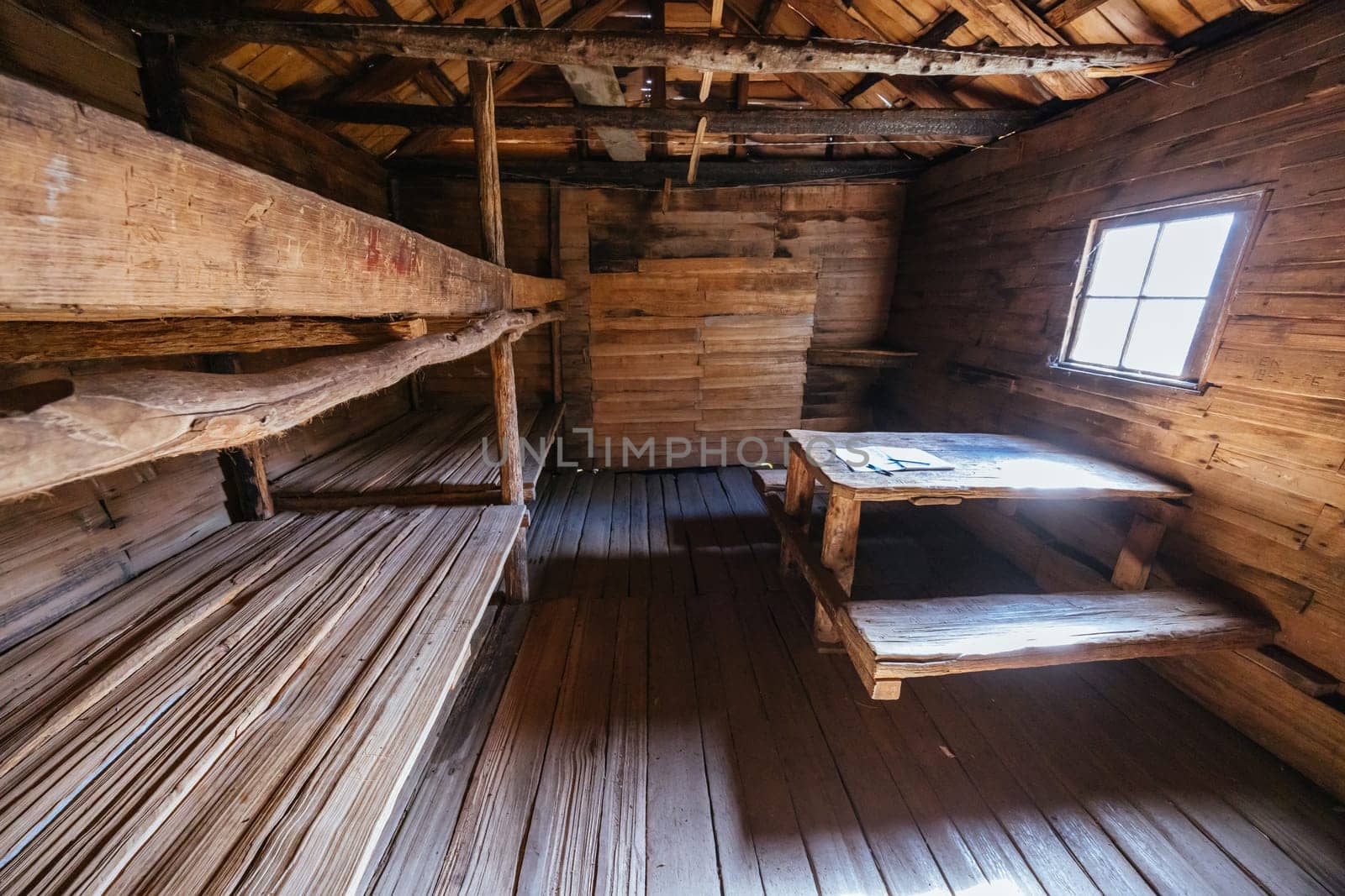 Iconic Du Cane Hut built by Patrick Joseph ‘Paddy’ Hartnett on the Overland Track is the oldest structure in the area. Photographed on a warm autumn morning in Cradle Mountain, Tasmania, Australia