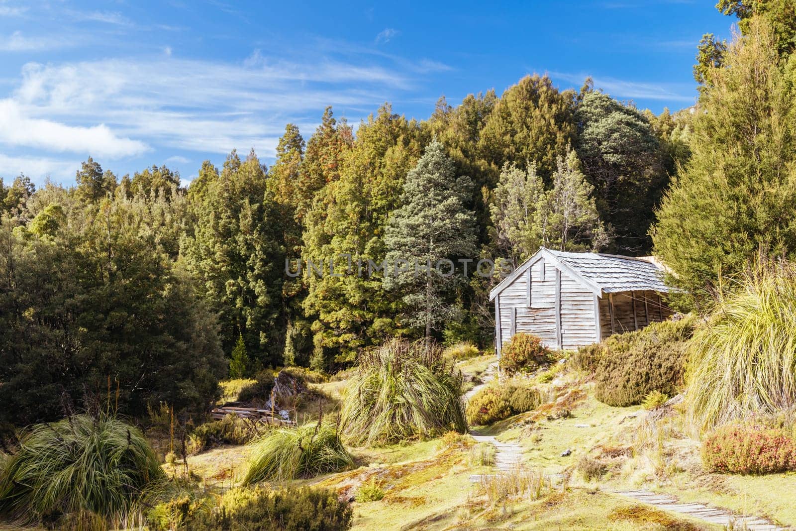 Iconic Du Cane Hut built by Patrick Joseph ‘Paddy’ Hartnett on the Overland Track is the oldest structure in the area. Photographed on a warm autumn morning in Cradle Mountain, Tasmania, Australia