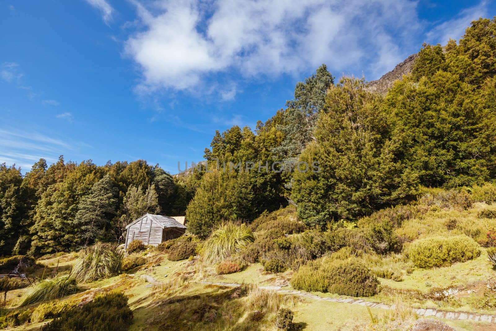 Iconic Du Cane Hut built by Patrick Joseph ‘Paddy’ Hartnett on the Overland Track is the oldest structure in the area. Photographed on a warm autumn morning in Cradle Mountain, Tasmania, Australia