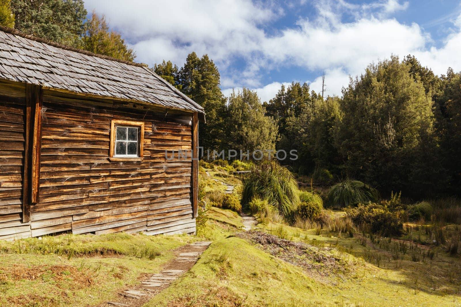 Iconic Du Cane Hut built by Patrick Joseph ‘Paddy’ Hartnett on the Overland Track is the oldest structure in the area. Photographed on a warm autumn morning in Cradle Mountain, Tasmania, Australia