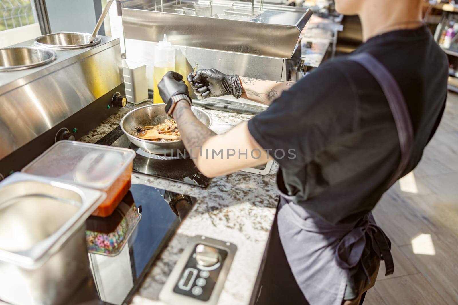 In a bustling kitchen, a skilled chef prepares a delightful dish while artfully handling fresh ingredients