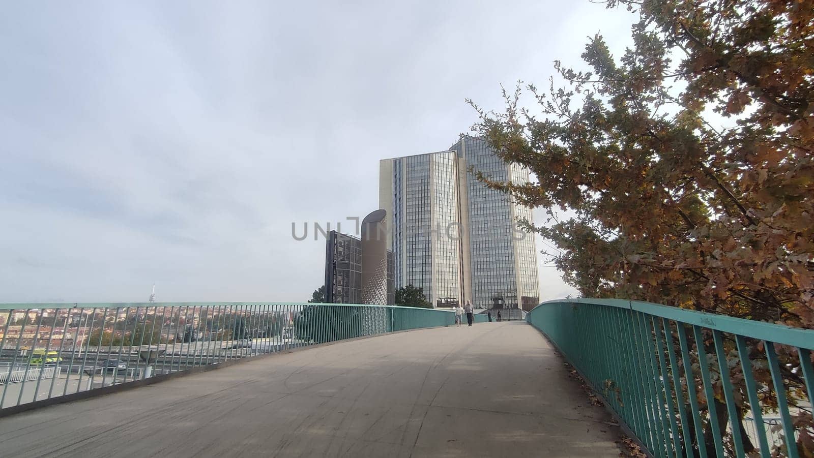 October 23 2024, Prague Czech Republic Europe, Grand Hotel, modern high-rise building, architecture city, view from the street, bridge. High quality photo Buildings bridge trees