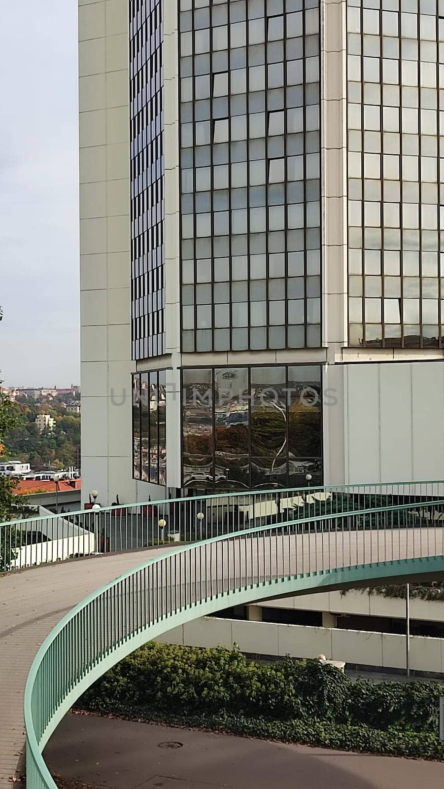 October 23 2024, Prague Czech Republic Europe, Grand Hotel, modern high-rise building, architecture city, view from the street, bridge. High quality photo Glass tower walkway editorial travel architecture