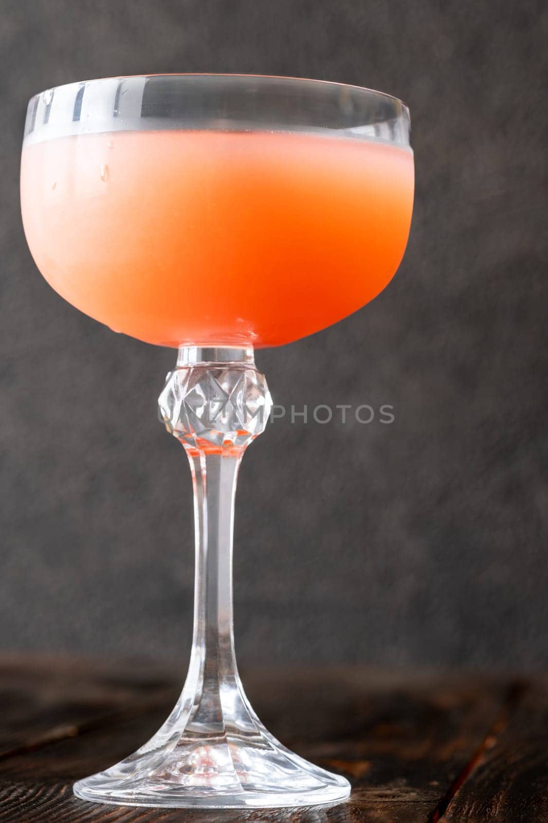 Coffee syrup and guava unite with rum, garnished by floating coffee beans