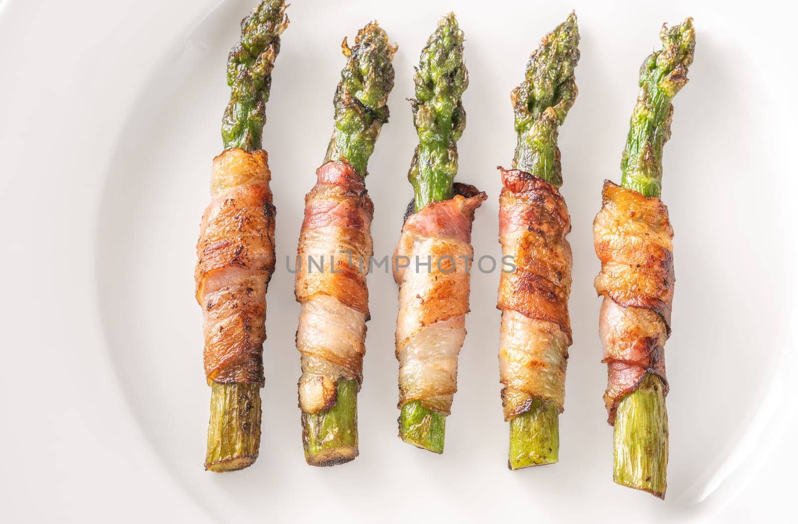 Golden bacon crisps around tender asparagus spears, savory and satisfying combination