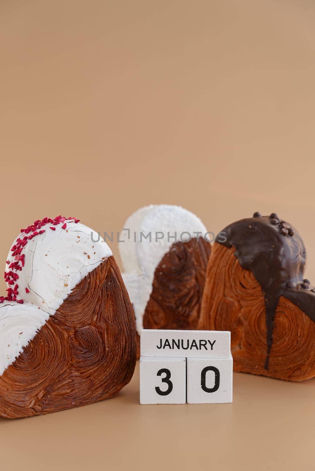 Calendar date 30 January national croissant day greeting card Delicious fresh croissant topped with colorful flavor Ganache. Creation unique heart shape bakery. Puff pastry holiday love gift present idea. Copy space