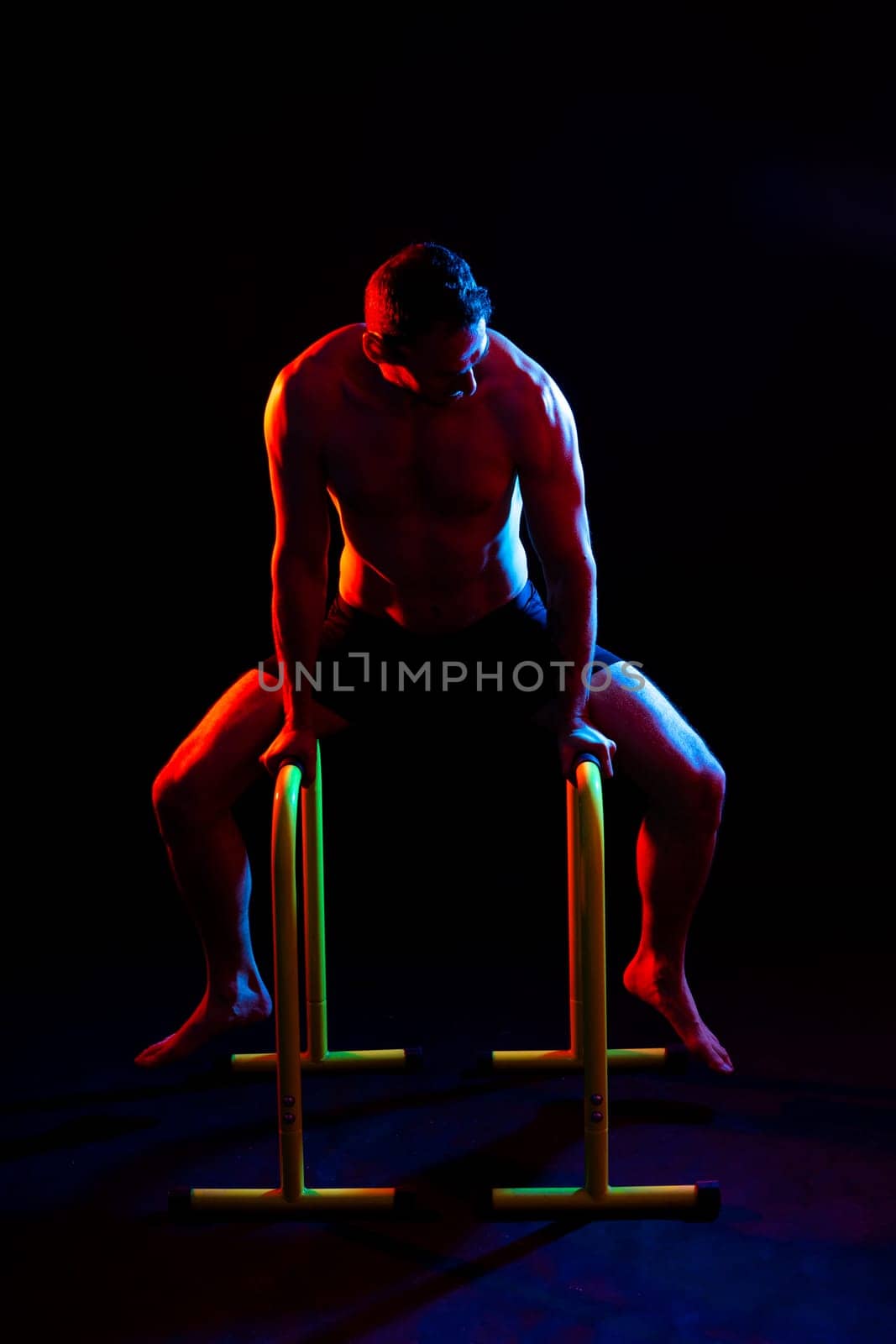 Portrait, happy man and bodybuilder with abs on a studio background, backdrop and topless pride