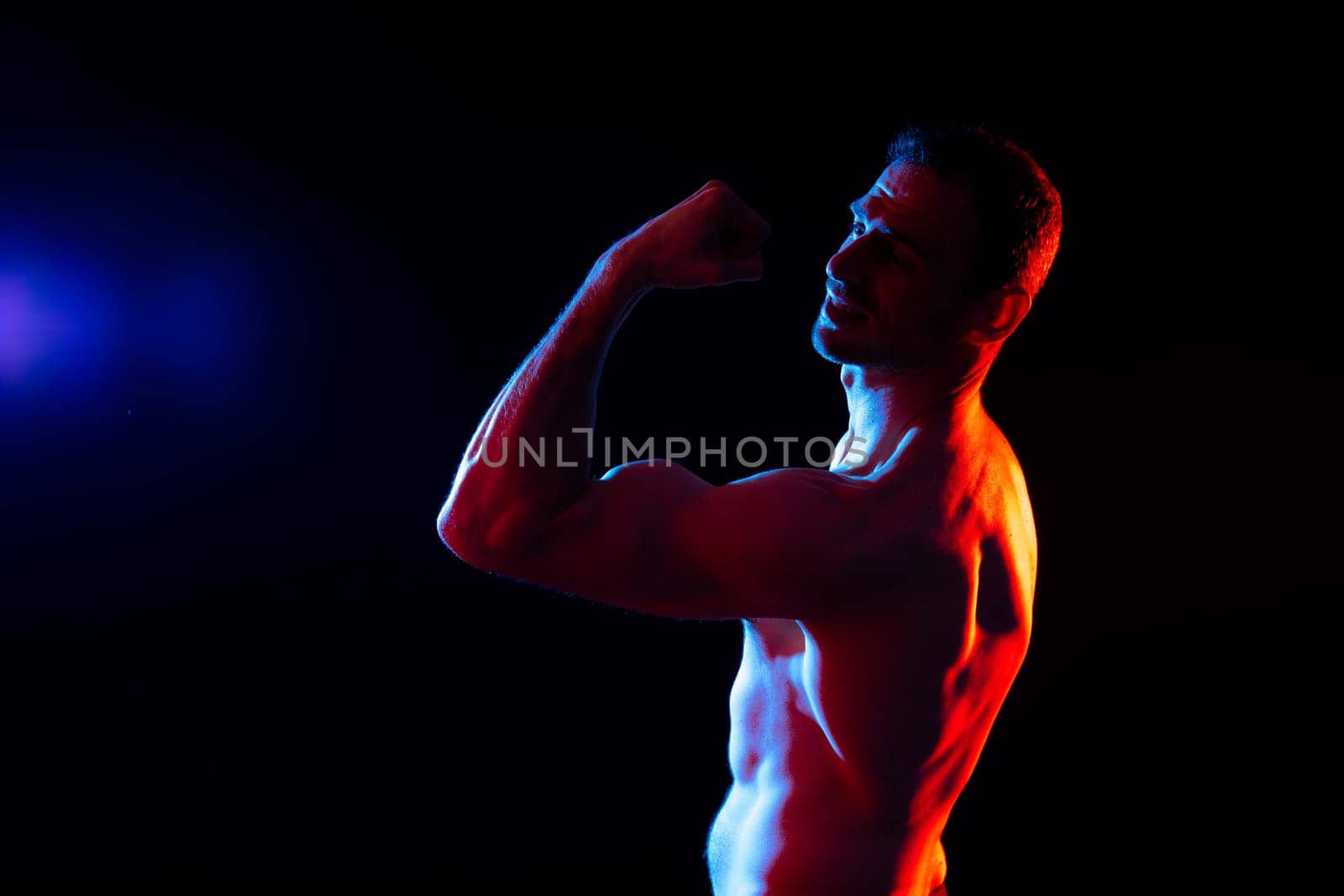 Portrait, happy man and bodybuilder with abs on a studio background, backdrop and topless pride