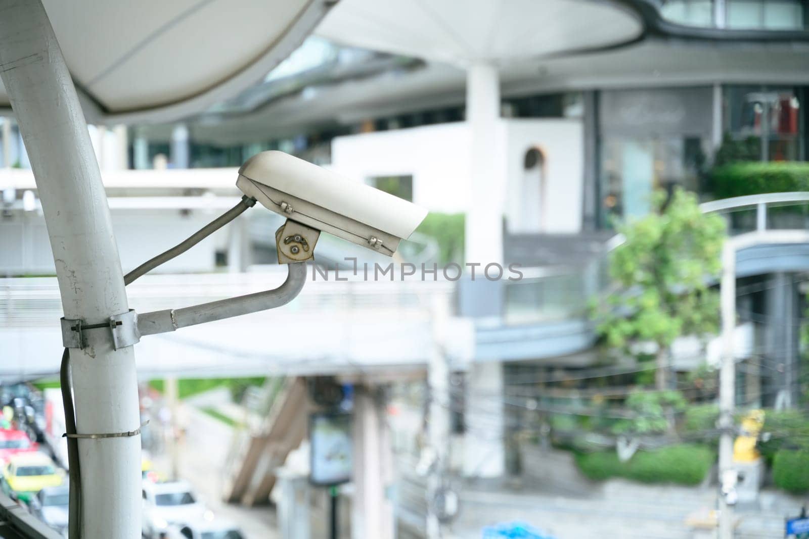 Close up of a CCTV security camera overlooking urban area.
