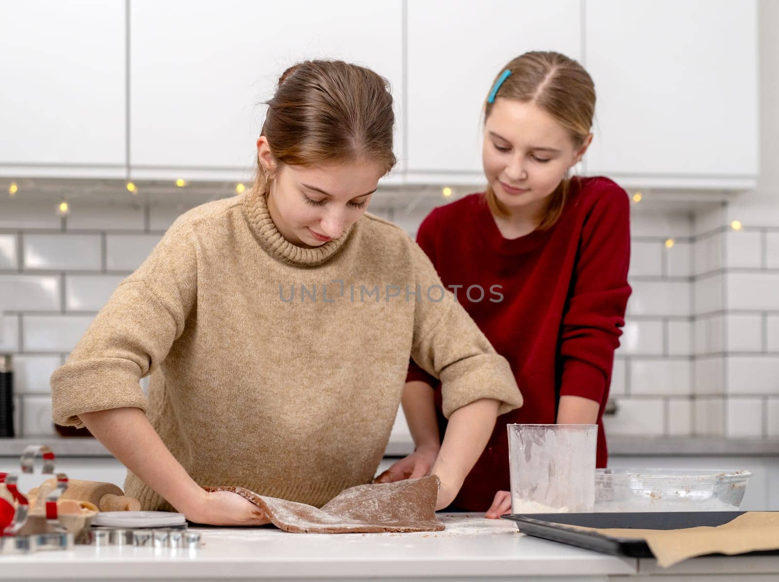 Little Sisters Making Dough For Gingerbread Cookies