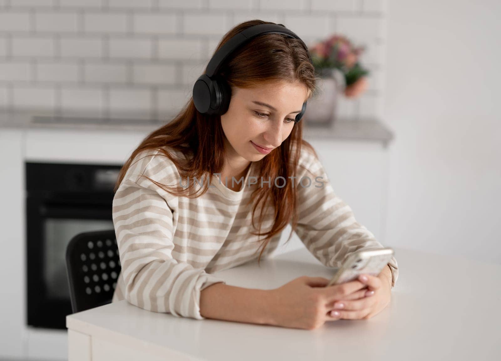 Happy Teen Girl Using Smartphone With Headphones
