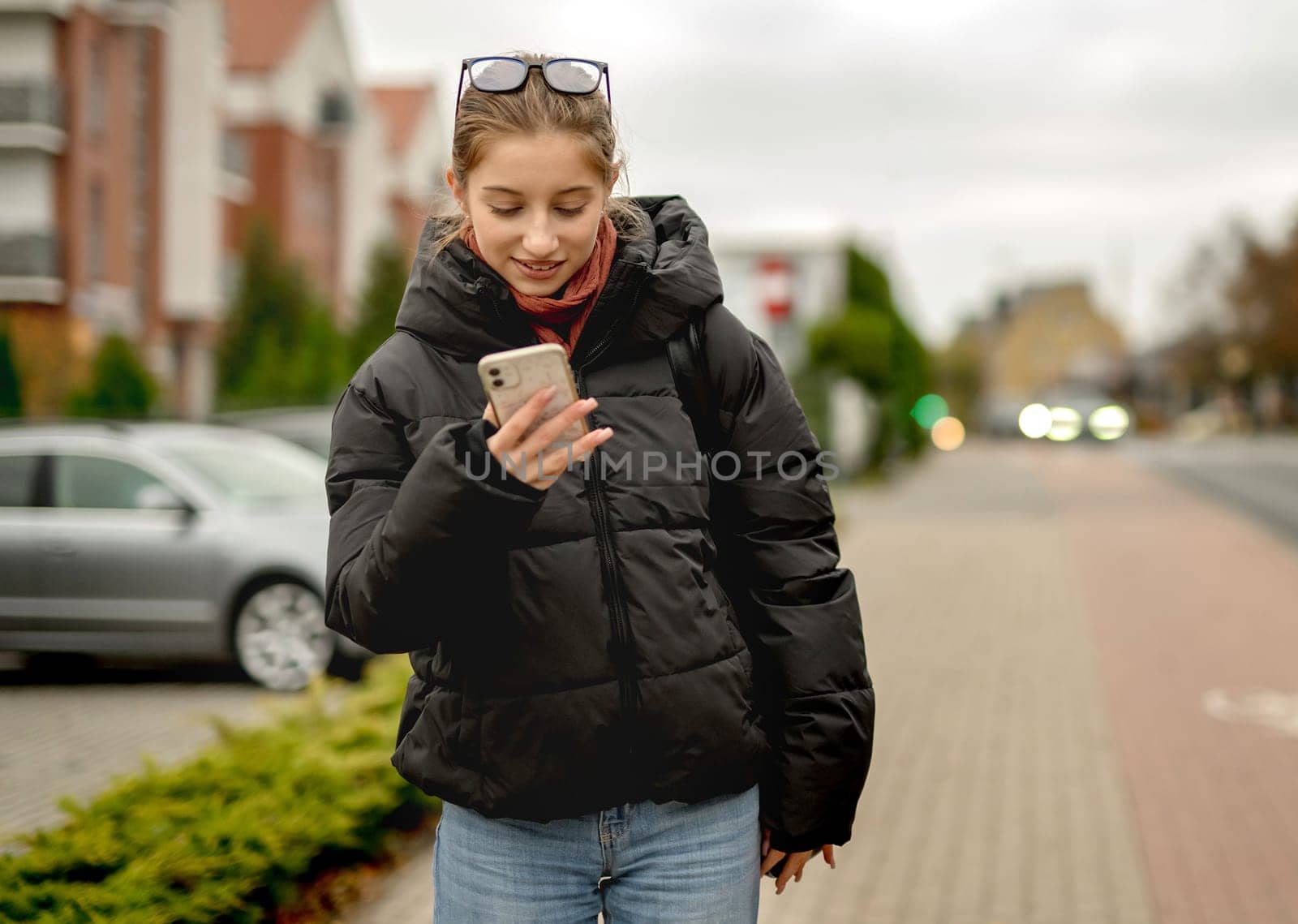Happy Girl Waits Outside For Someone In Spring