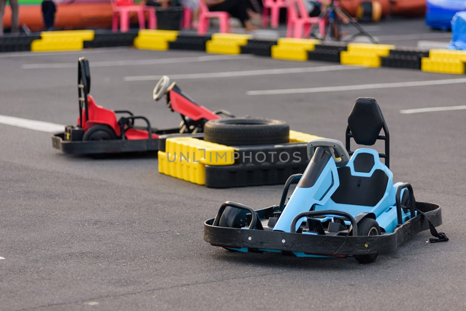 Go-kart adrenaline rush. Powerful go kart machines wait at the starting line, ready to speed through an intense race.