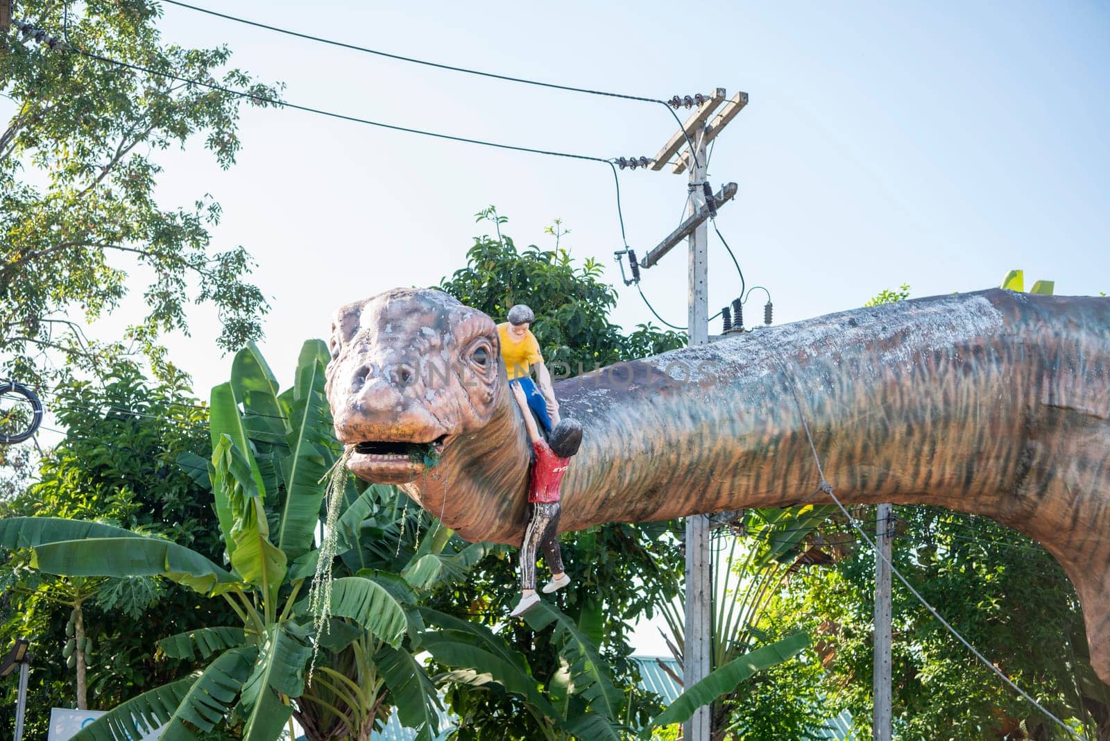 A Dinosaur Monument at a Village in Amphoe Phu Wiang in  Province of Khon Kaen in Thailand. Thailand, Khon Kaen, December, 6, 2024