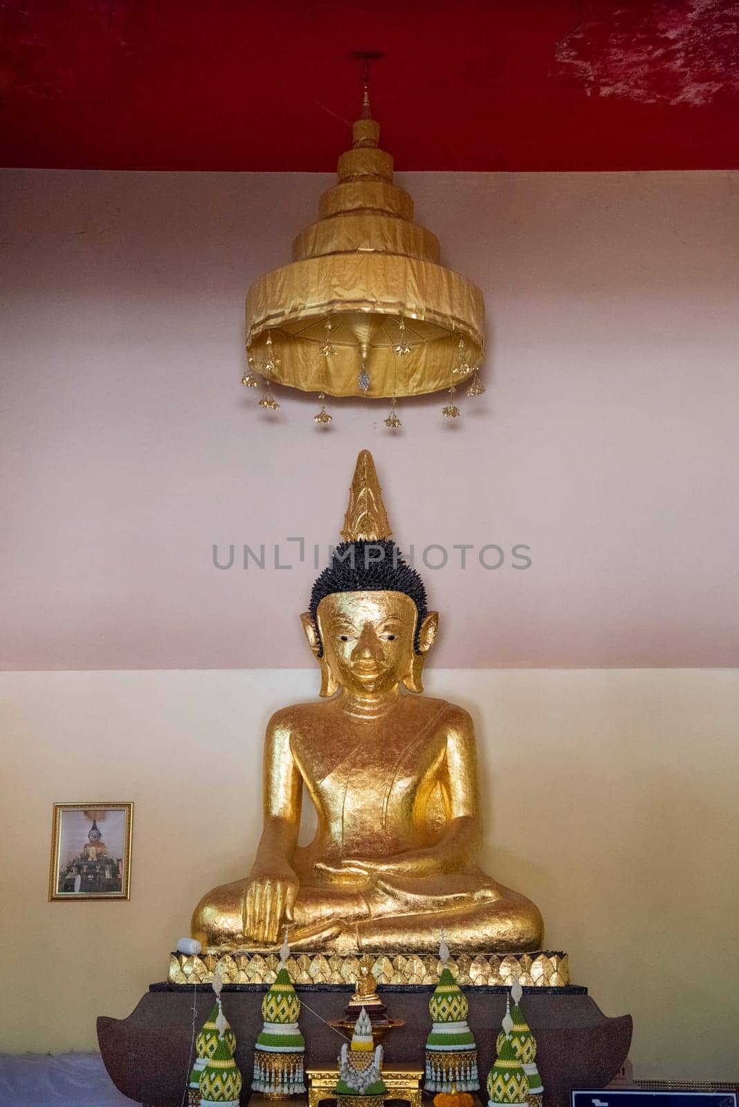 Buddha inside of Wat Phrathat Kham Kaen in the Province of Khon Kaen in Thailand. Thailand, Khon Kaen, December, 8, 2024