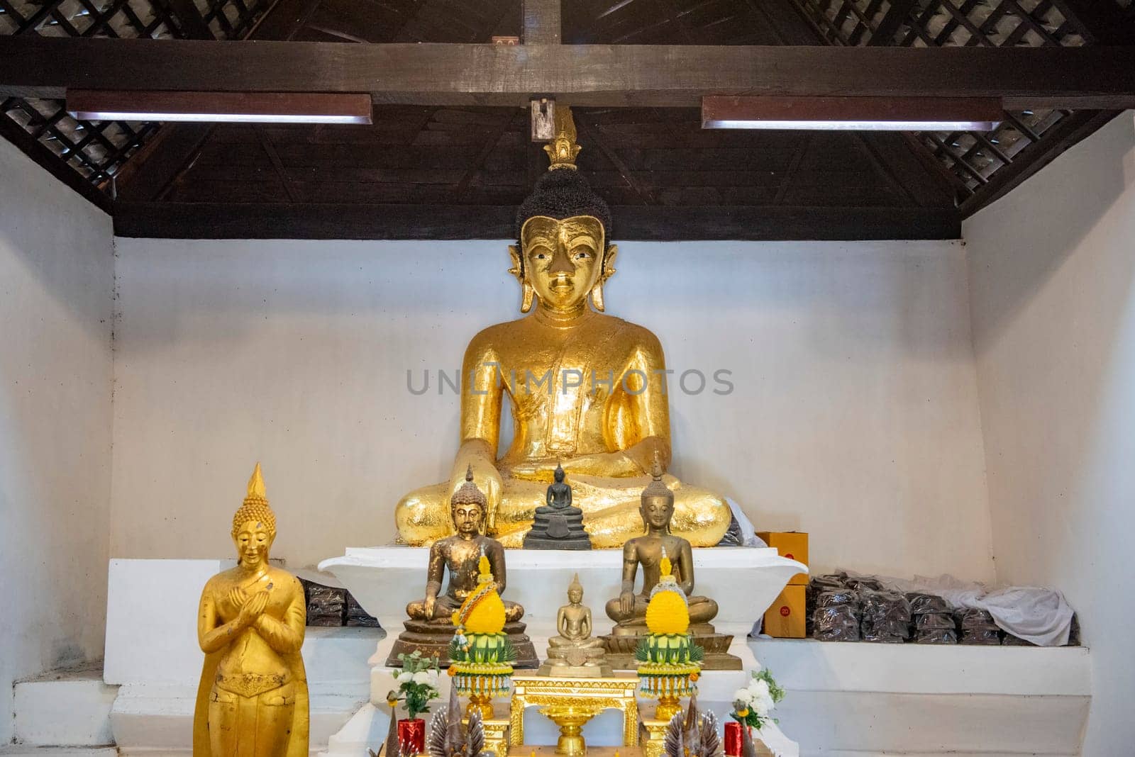 Buddha inside of Wat Phrathat Kham Kaen in the Province of Khon Kaen in Thailand. Thailand, Khon Kaen, December, 8, 2024