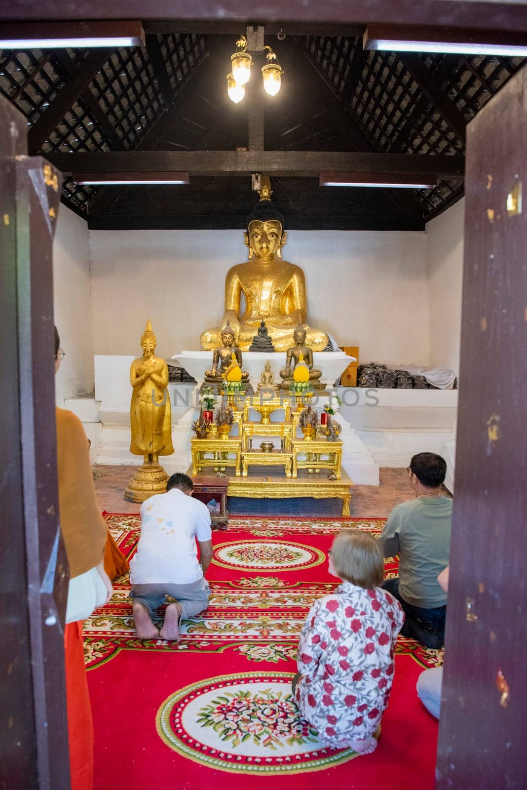 Buddha inside of Wat Phrathat Kham Kaen in the Province of Khon Kaen in Thailand. Thailand, Khon Kaen, December, 8, 2024