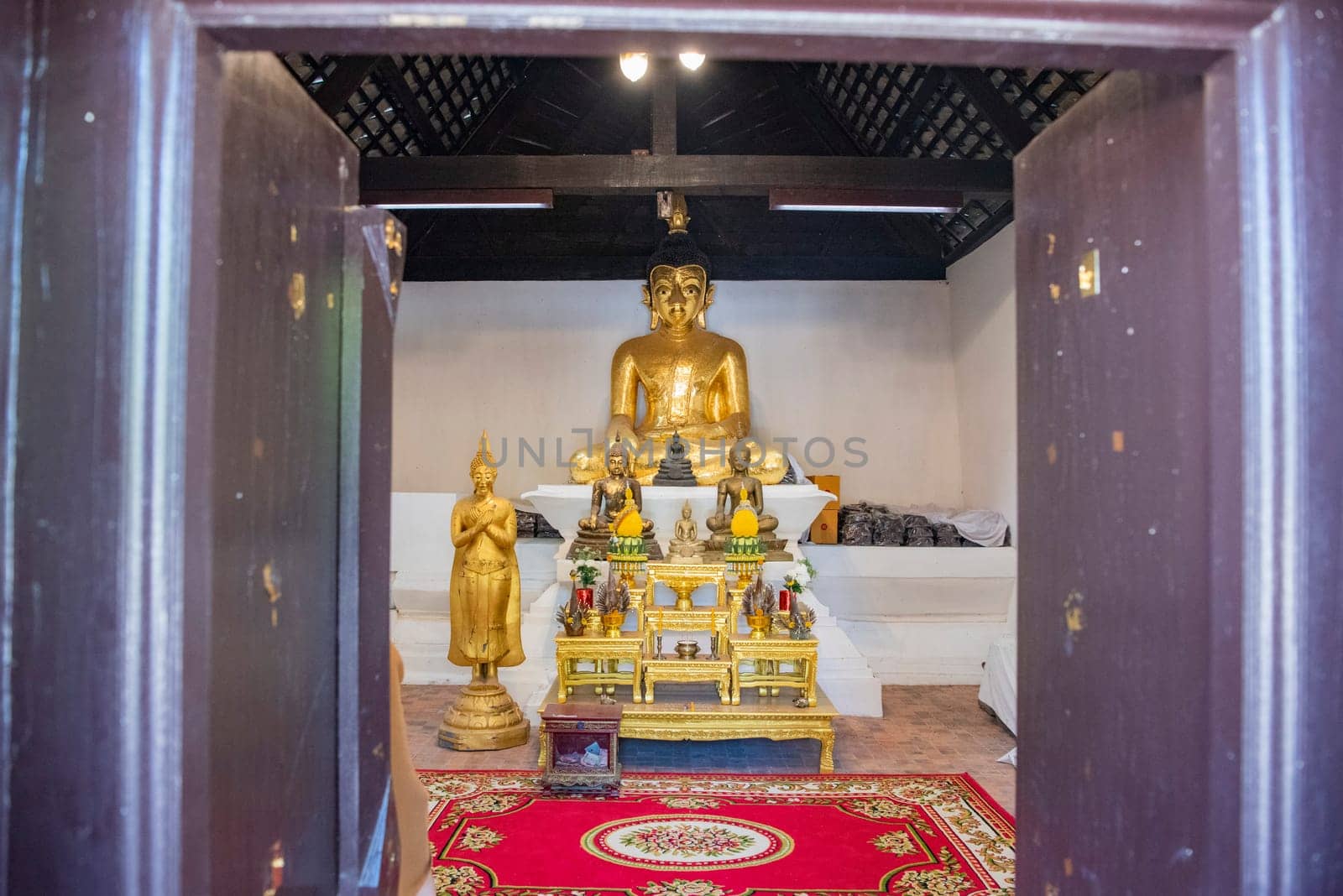 Buddha inside of Wat Phrathat Kham Kaen in the Province of Khon Kaen in Thailand. Thailand, Khon Kaen, December, 8, 2024