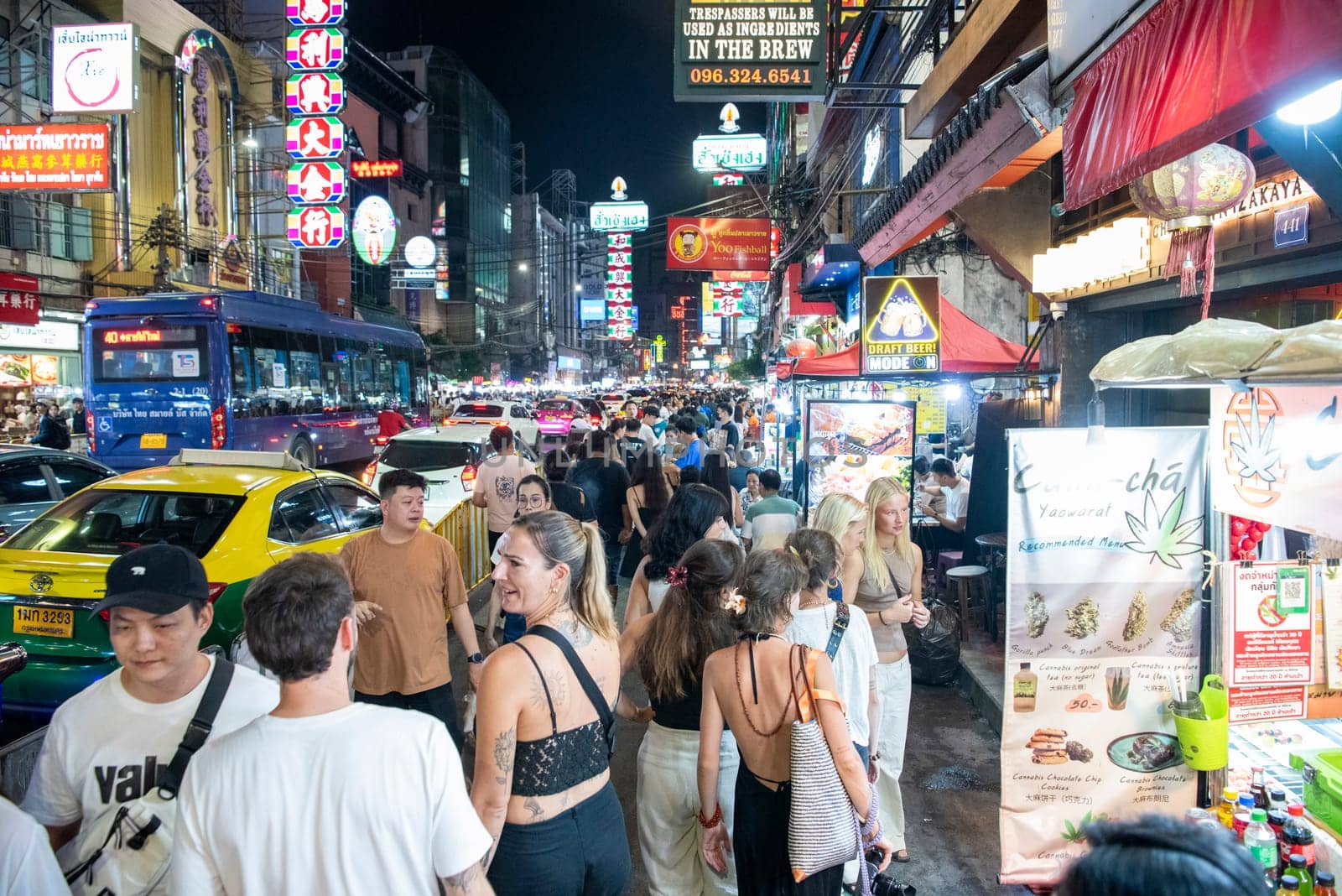 People and Taxi at Marketstreet on Yaowarat Road in Chinatown in City of Bangkok in Thailand.  Thailand, Bangkok, November, 4, 2024.