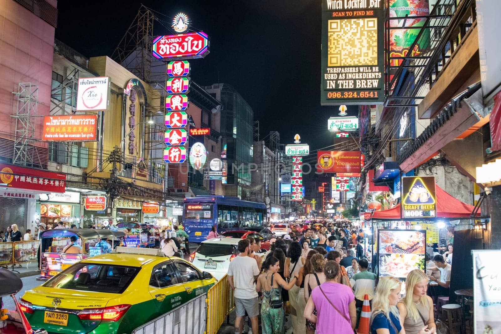 People and Taxi at Marketstreet on Yaowarat Road in Chinatown in City of Bangkok in Thailand.  Thailand, Bangkok, November, 4, 2024.