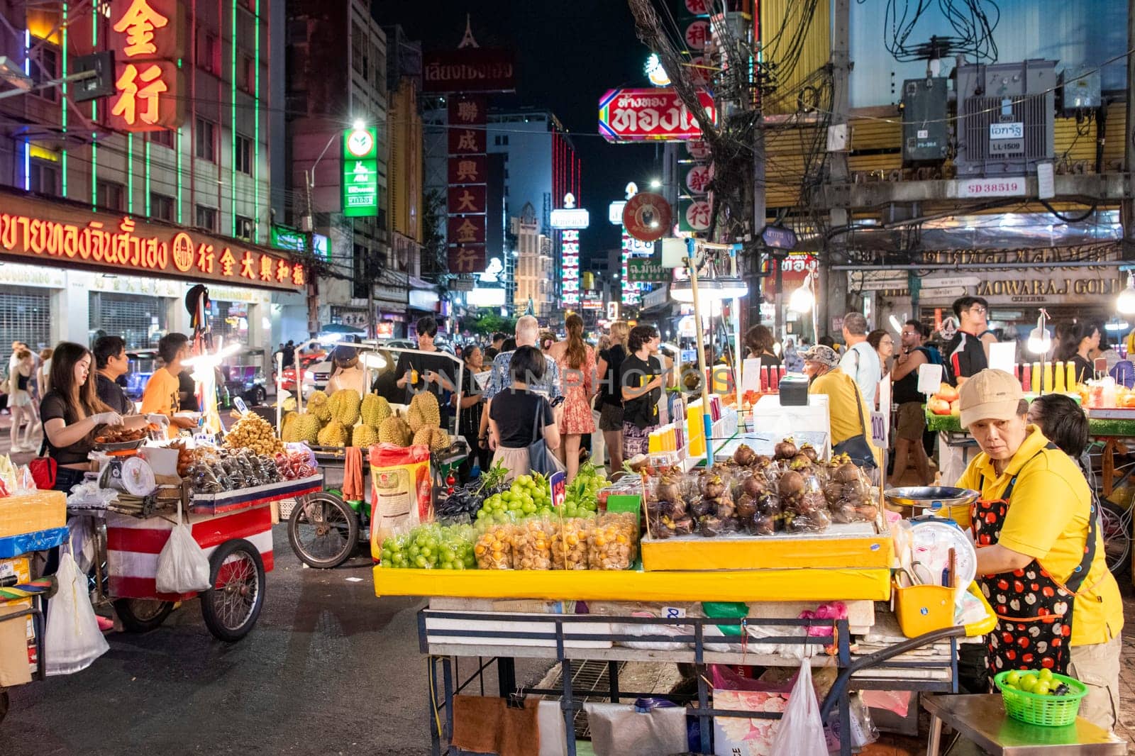 People and shops at Night Streetmarket on Yaowarat Road in Chinatown in City of Bangkok in Thailand.  Thailand, Bangkok, November, 4, 2024.