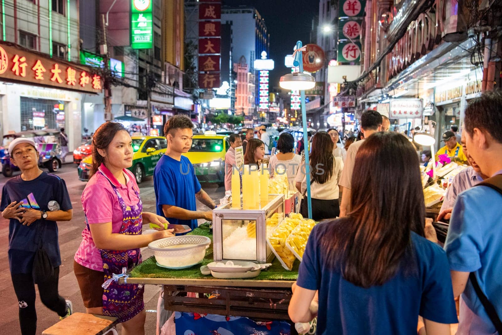People and shops at Night Streetmarket on Yaowarat Road in Chinatown in City of Bangkok in Thailand.  Thailand, Bangkok, November, 4, 2024.