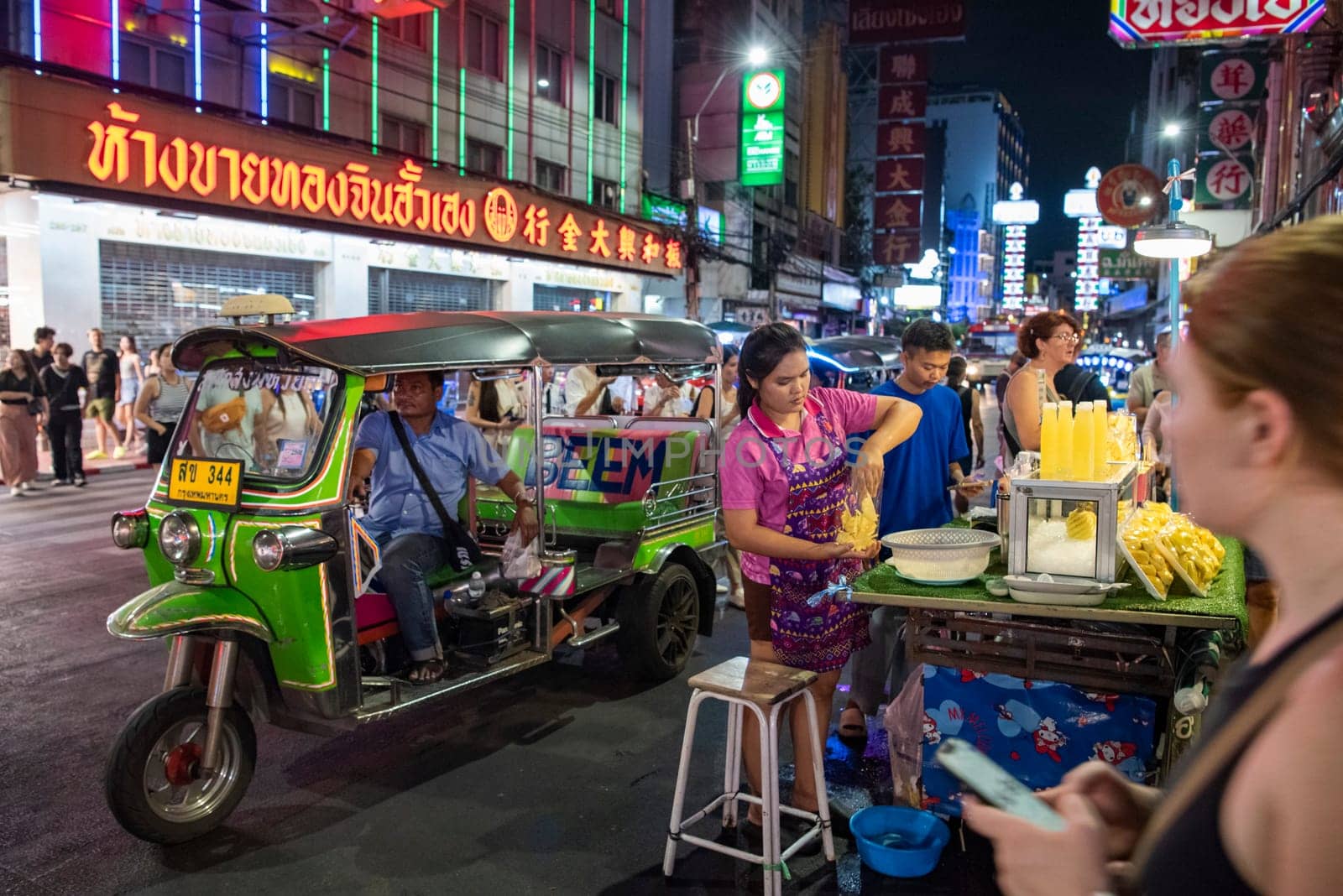 People and shops at Night Streetmarket on Yaowarat Road in Chinatown in City of Bangkok in Thailand.  Thailand, Bangkok, November, 4, 2024.
