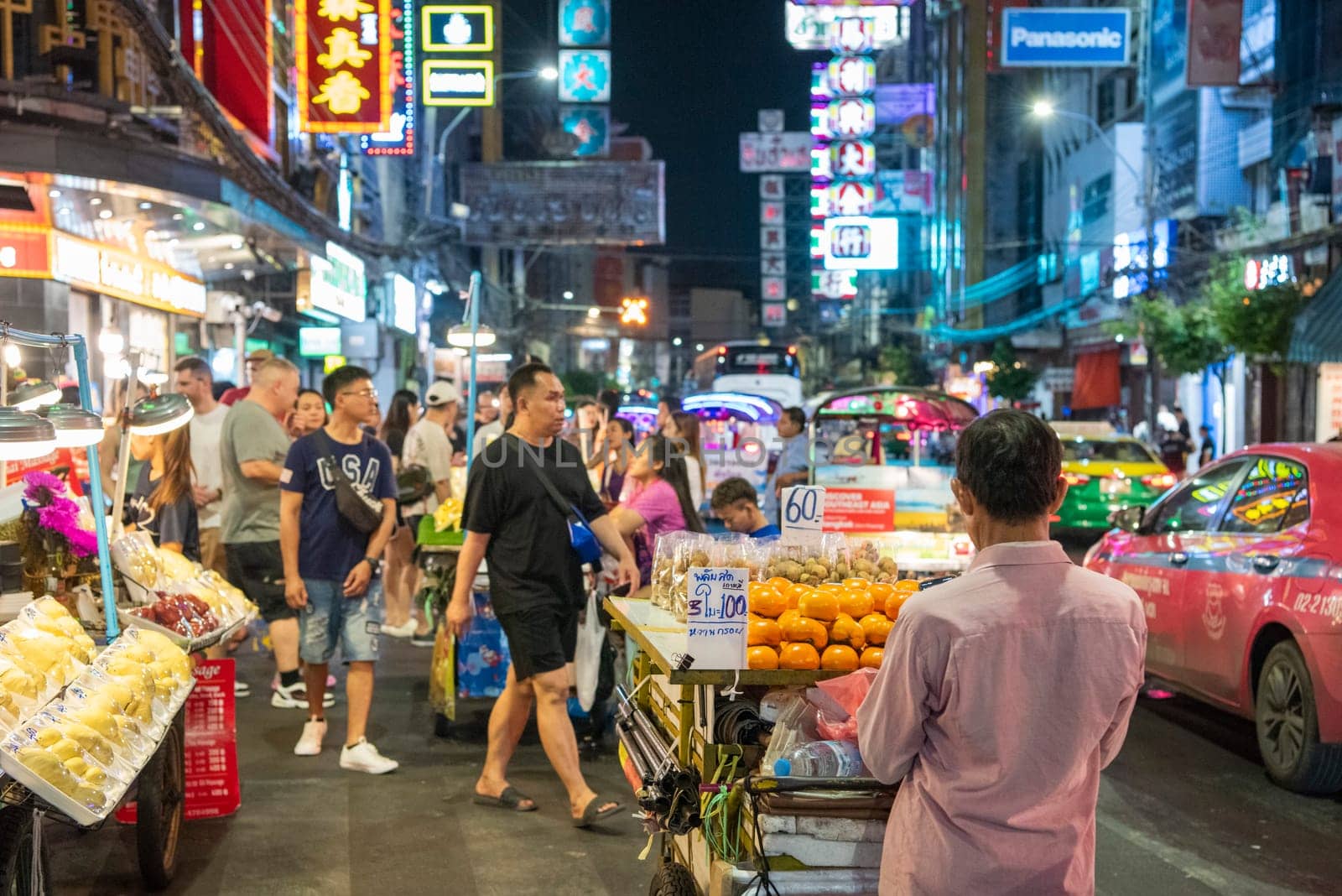 People and shops at Night Streetmarket on Yaowarat Road in Chinatown in City of Bangkok in Thailand.  Thailand, Bangkok, November, 4, 2024.