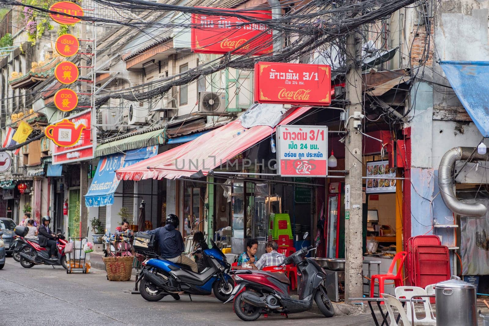 a street with shops and Market the China Town with skyline in the City of Bangkok in Thailand.  Thailand, Bangkok, November, 5, 2024.